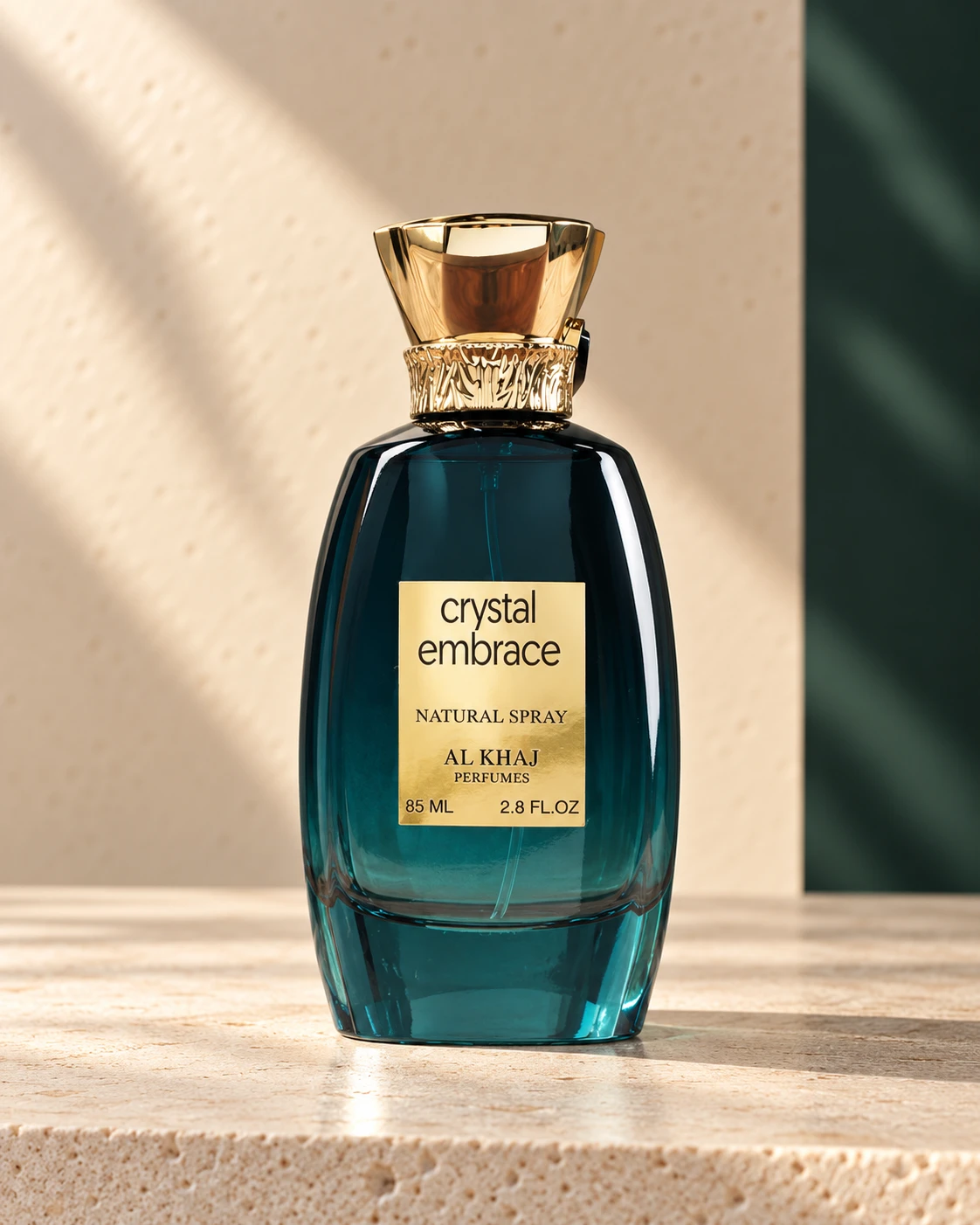 Crystal Embrace by Al Khaj, with its deep teal glass and sculpted gold cap
